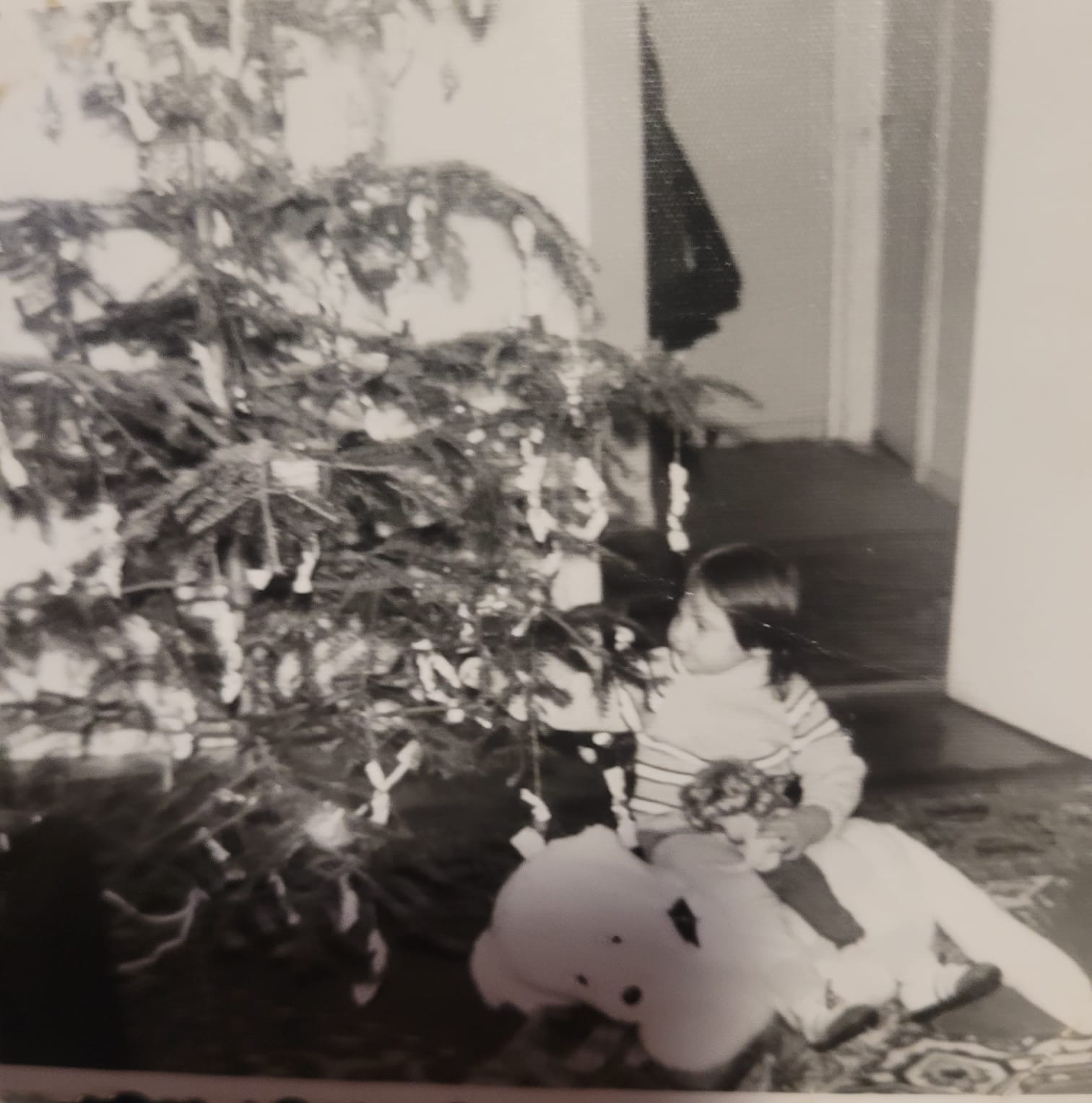 Claudia as a child with Topi, the dog who inspired her story